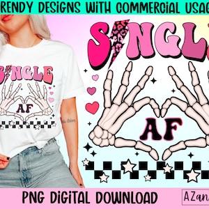 May include: A digital download graphic design featuring a pink and white text graphic that says "SINGLE AF" with a pair of skeleton hands making a heart shape around the text. The design is set against a black and white checkered background with pink hearts and white stars.