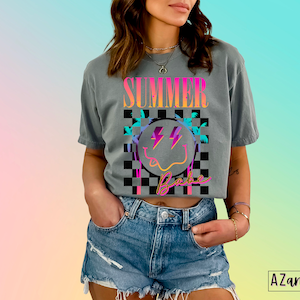 May include: A gray cropped t-shirt with a colorful graphic design that says "Summer Babe" with a smiley face and palm trees. The graphic is on a checkered background.