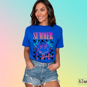 May include: A blue t-shirt with a graphic of a smiley face with lightning bolts and palm trees. The text "Summer Vibe" is printed on the shirt.