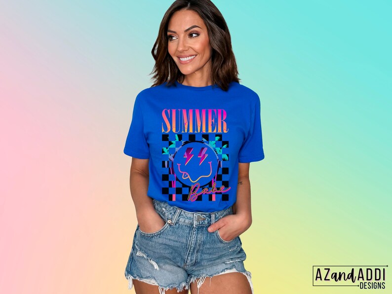 May include: A blue t-shirt with a graphic of a smiley face with lightning bolts and palm trees. The text "Summer Vibe" is printed on the shirt.