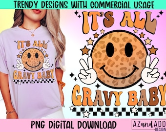May include: A digital download of a graphic design featuring a smiling leopard print face with peace signs and the text "It's All Gravy Baby" in a retro 70s style font.