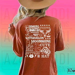 May include: A rust-coloured t-shirt with a white graphic design featuring the text "Cowgirl Fringe Boots", "Howdy Y'all", "Watermelon", "Moonshine", "Cute", "Bell Bottoms", and "Boho Hat".