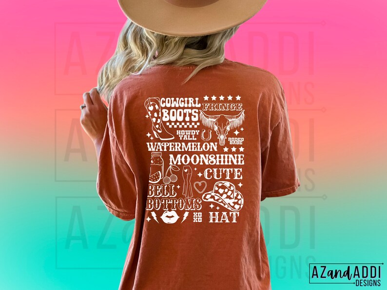 May include: A rust-coloured t-shirt with a white graphic design featuring the text "Cowgirl Fringe Boots", "Howdy Y'all", "Watermelon", "Moonshine", "Cute", "Bell Bottoms", and "Boho Hat".