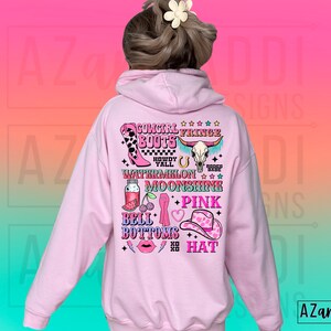 May include: Pink hoodie with a graphic print of a cowgirl wearing fringe boots, a watermelon, moonshine, bell bottoms, and a pink hat. The text on the graphic says "Cowgirl Fringe Boots Howdy Y'all Watermelon Moonshine + Pink Bell Bottoms Hat".