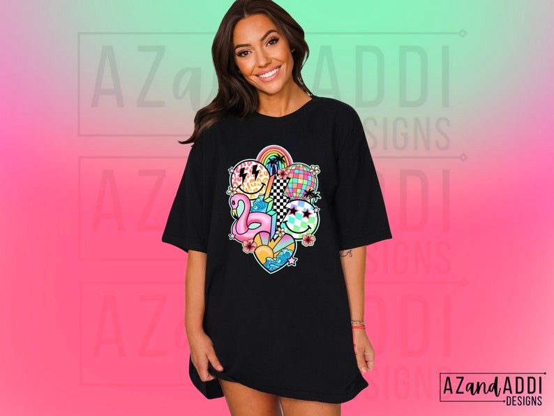 May include: Black oversized t-shirt with a colorful graphic print of a rainbow, a flamingo, a disco ball, and smiley faces. The graphic is centered on the shirt.