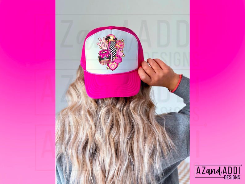 May include: A pink trucker hat with a white mesh back. The hat has a colorful graphic design featuring a heart, a peace sign, a palm tree, and other elements.