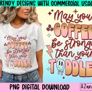 May include: A digital download of a graphic design featuring a pink and gold coffee cup with the text "May your coffee be stronger than your toddler".