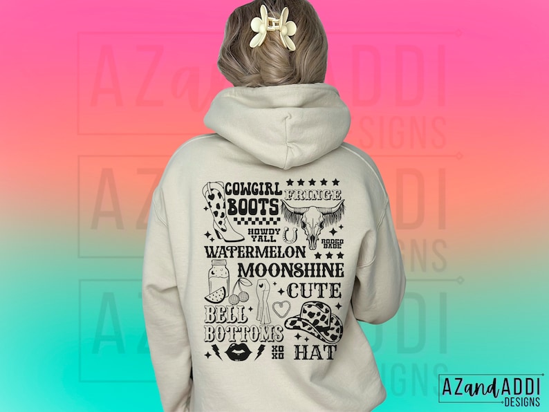May include: A white hoodie with a black graphic print on the back. The graphic includes the text "Cowgirl Fringe Boots", "Howdy Y'all", "Watermelon", "Moonshine", "Bell Bottoms", and "Cute Hat".
