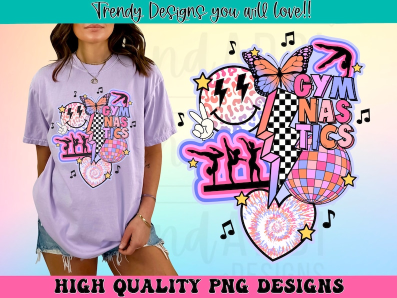 May include: A purple t-shirt with a colorful graphic design featuring a heart, a disco ball, a butterfly, a gymnast, and the text "GYM NAS TICS".