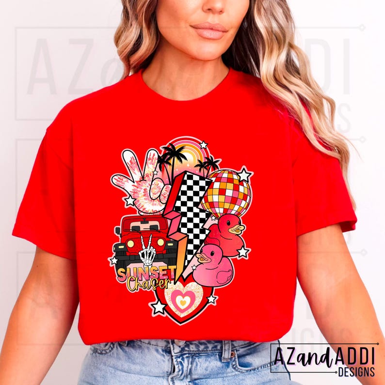 May include: Red t-shirt with a graphic design featuring a red jeep, a lightning bolt, a peace sign, palm trees, a disco ball, and rubber ducks. The text "Sunset Chaser" is printed on the shirt.