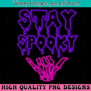 May include: Purple and pink neon sign with the text "STAY SPOOKY" and a pink skeleton hand making a shaka sign.