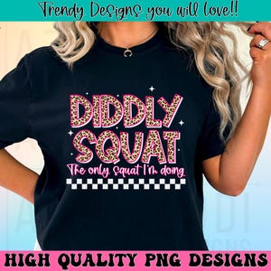 May include: Black t-shirt with a pink and brown leopard print design that says "Diddly Squat" and "The only squat I'm doing".