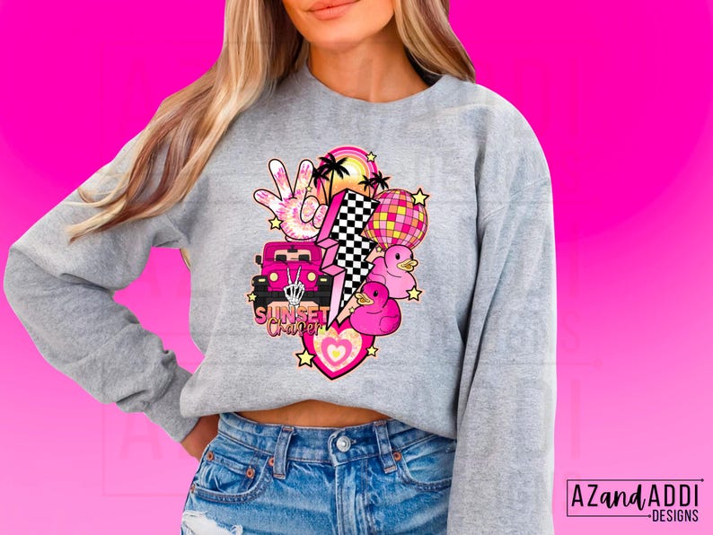 May include: Gray sweatshirt with a pink and white graphic design featuring a car, a lightning bolt, a peace sign, palm trees, a disco ball, and rubber ducks. The text "Sunset Chaser" is included in the design.