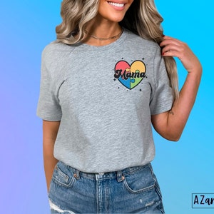 May include: A gray t-shirt with a colorful puzzle piece heart design that says "Mama" in a retro font.