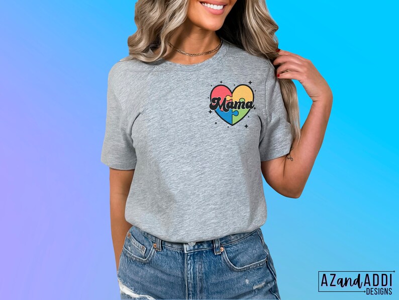 May include: A gray t-shirt with a colorful puzzle piece heart design that says "Mama" in a retro font.