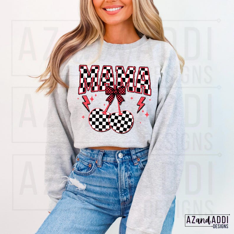 May include: A gray sweatshirt with a checkered pattern design that says "MAMA" in black and white with a red bow and cherries. The cherries are also checkered.