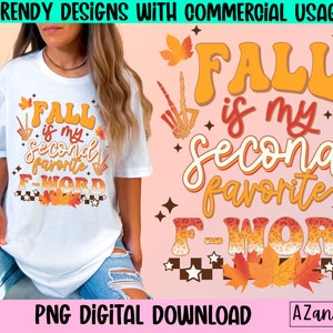 Könnte beinhalten: Weißes T-Shirt mit dem Text "FALL is my second favorite F-WORD" in Orange und Weiß, mit Herbstblatt- und Skelett-Hand-Grafiken. Das Shirt ist ein PNG-Digital-Download.