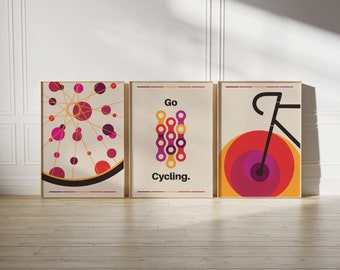 Peut inclure: Trois affiches encadrées présentant des graphismes sur le thème du cyclisme. La gauche montre une roue de vélo avec des cercles rouges et violets. Le centre affiche une chaîne de vélo avec le texte "Go Cycling." La droite représente un cadre.