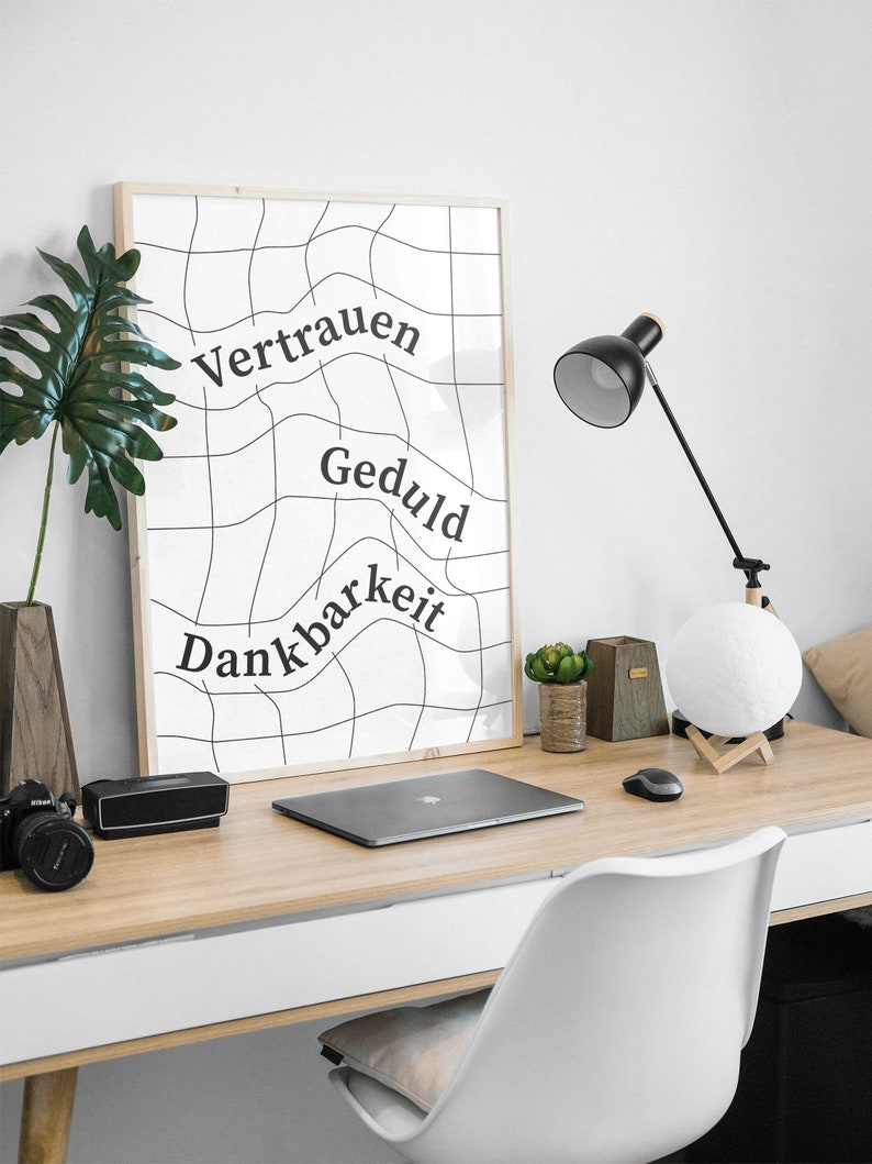 May include: A black and white poster with a grid pattern and the words "Vertrauen", "Geduld", and "Dankbarkeit" written in a curved font.