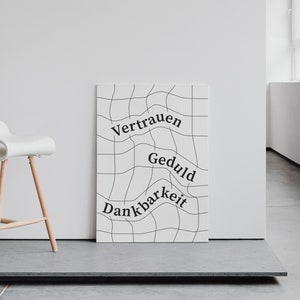 May include: A white poster with black grid lines and the words "Vertrauen", "Geduld", and "Dankbarkeit" written in a wavy font.