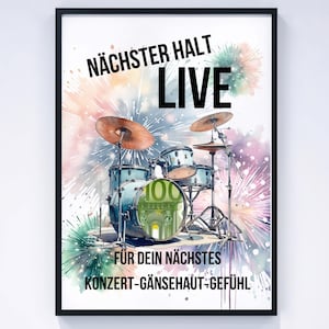 May include: A framed print with a watercolour illustration of a drum kit and cymbals. The artwork includes text that reads "NÄCHSTER HALT LIVE" and "FÜR DEIN NÄCHSTES KONZERT-GÄNSEHAUT-GEFÜHL". The drum kit is blue with a 100 Euro note in the center.
