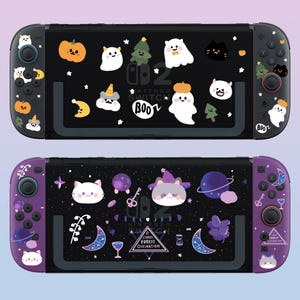 May include: Two Nintendo Switch consoles with different designs. The top console has a black and white design with a Halloween theme. The bottom console has a purple and black design with a starry night theme. Both consoles have custom designs on the back and front.