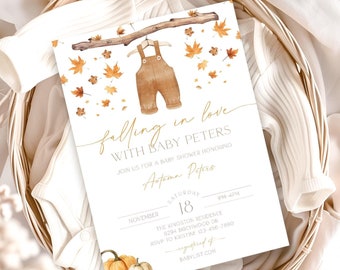Peut inclure: Une invitation à une baby shower avec le texte "falling in love with Baby Peters". L'invitation présente une illustration à l'aquarelle d'une salopette marron suspendue à une branche, entourée de feuilles d'automne. Des citrouilles sont en bas.