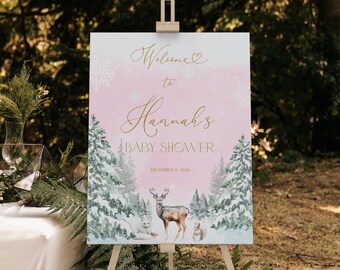 May include: Welcome to Hannah's Baby Shower sign with a pink and blue watercolor background featuring a snowy forest scene with a deer, a fox, and a rabbit. The text is in gold lettering.