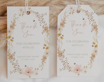 May include: Two white thank you tags with a floral wreath design. The text on the tags reads "Thank You" and "For Celebrating With Us!"  The tags are tied with twine and are perfect for a baby shower.