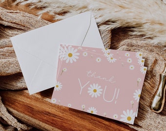May include: Pink thank you card with white daisies and the text "thank YOU!" printed on it.