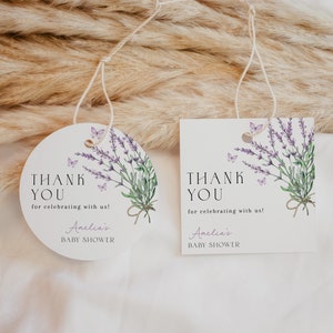 May include: Two round thank you tags with lavender and butterflies. The text reads "Thank You for celebrating with us! Amelia's Baby Shower".