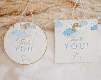 May include: Two thank you tags with a blue and gold moon and stars design. The text on the tags reads "Thank you" with the name "Emily" below.