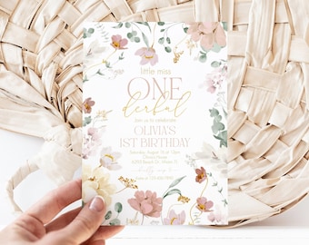 May include: A rectangular invitation card featuring a white background with a floral border of pink, yellow, and green watercolor flowers. The text reads little miss ONEderful, Join us to celebrate OLIVIA'S 1ST BIRTHDAY, Saturday, August 18 at 12pm.