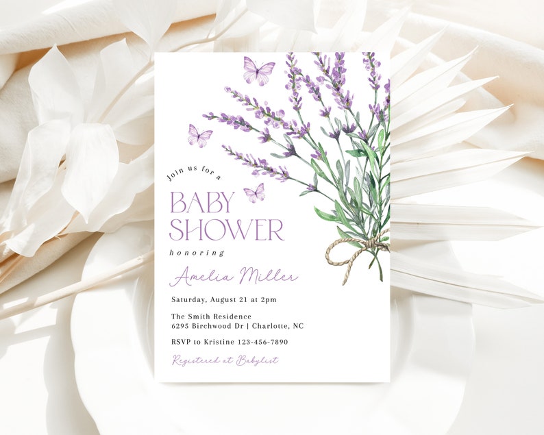 May include: A lavender-themed baby shower invitation with watercolor illustrations of lavender flowers and butterflies. The text reads "Join us for a Baby Shower honoring Amelia Miller. Saturday, August 21 at 2pm. The Smith Residence 6295 Birchwood Dr | Charlotte, NC. RSVP to Kristine 123-456-7890. Registered at Babylist."