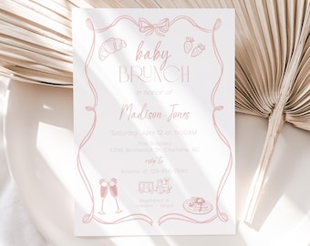 Op de afbeelding: Een roze babyborrel uitnodiging met een roze lint en strik, een croissant, aardbeien, champagne glazen, een trein en een bord met pannenkoeken. De tekst luidt "baby brunch" ter ere van "Madison Jones". De uitnodiging bevat de datum, tijd, locatie en RSVP-informatie.