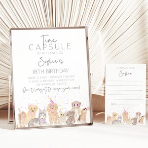 Puede incluir: Un cartel blanco con marco plateado que dice "Time Capsule to be opened on Sophia's 18th Birthday. Write a sweet message for her, a wish, a memory, a prediction or words of advice. Don't forget to sign your name!"  El cartel tiene una imagen de dibujos animados de perros con sombreros de fiesta en la parte inferior. Hay una tarjeta blanca más pequeña con el texto "A message for Sophia" y una imagen de dibujos animados de perros con sombreros de fiesta en la parte inferior.