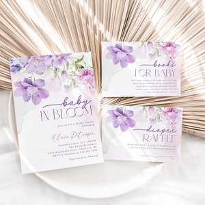 May include: Purple floral baby shower invitation with the text "baby in bloom" and details for a bridal shower for Elsie Peterson.  There are two additional cards with the text "books for baby" and "diaper raffle".