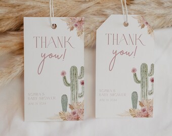May include: Two white thank you tags with pink and brown floral designs and a green cactus illustration. The text on the tags reads "Thank you!" and includes the text "Sophia's Baby Shower" and the date "June 21, 2024".