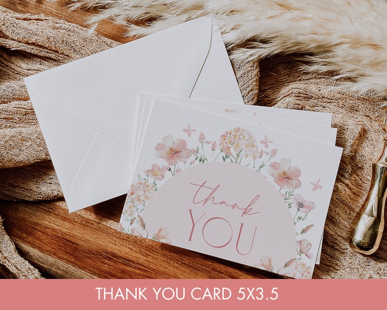 May include: A thank you card with a floral design in shades of pink and white. The card features a pink circle with the text "thank you" in a cursive font. The card measures 5x3.5 inches.