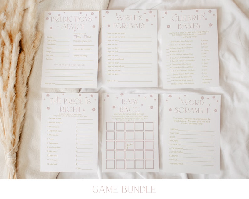 May include: A set of printable baby shower games with a pink and gold color scheme. The games include "Predictions + Advice", "Wishes for Baby", "Celebrity Babies", "The Price is Right", "Baby Bingo", and "Word Scramble".