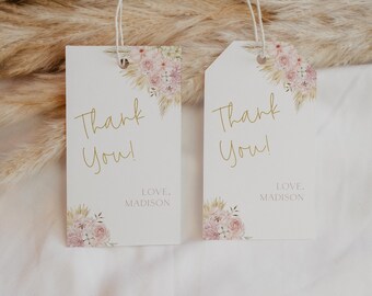 May include: Two white gift tags with gold lettering that says "Thank You!" and "LOVE, MADISON". The tags are decorated with watercolor illustrations of pink flowers and dried grasses.
