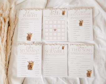 Op de afbeelding: Een set van tien printbare babyshower-spelkaarten met een roze en bloemig ontwerp met een Highland-koe-illustratie. De spellen omvatten "Price is Right", "Baby Bingo", "Animal Gestation Game", "Who's My Mama?", "Word Scramble" en "Name That Song".