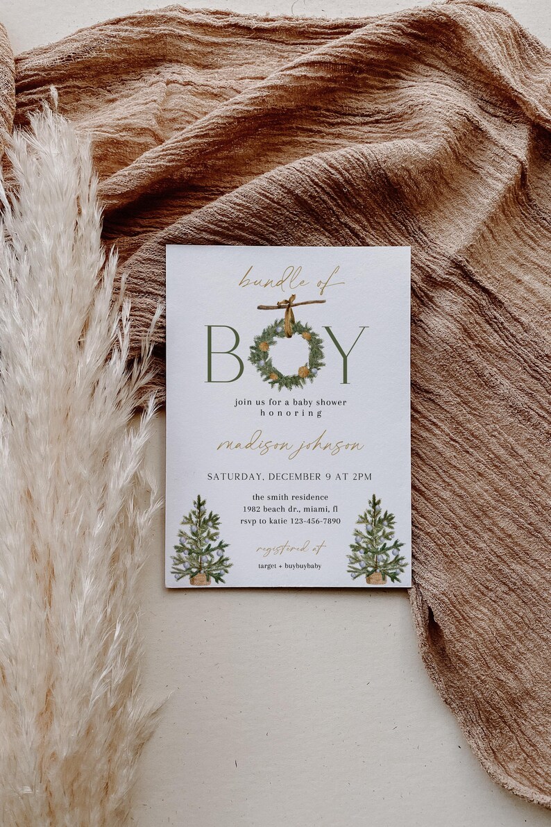 May include: Baby shower invitation with the words "bundle of BOY" in green and gold. The invitation includes details for the event, such as the date, time, and location. The invitation is decorated with illustrations of Christmas trees.