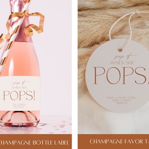 Peut inclure: Une &eacute;tiquette de faveur pour bouteille de champagne avec le texte "pop it when she pops!" et "enjoy a toast when baby arrives". L'&eacute;tiquette est ronde et blanche avec du texte brun. L'&eacute;tiquette est sur un fond brun et duveteux.