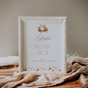 May include: A white framed sign with the text "Editable Blank Sign" and a coffee cup illustration. The sign is 8x10 inches and has a decorative border. The frame is set on a wooden tray with a beige fabric.