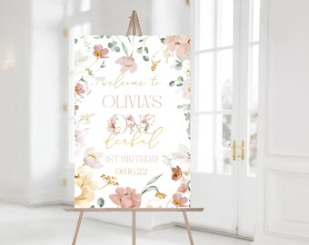 Könnte beinhalten: Willkommen zu Olivias One Derful 1. Geburtstagsparty-Schild mit einem floralen Design in den Farben Rosa, Gelb und Grün. Das Schild hat einen weißen Hintergrund mit goldenen Buchstaben.