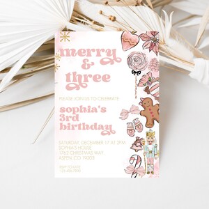 May include: A pink and gold invitation for Sophia's 3rd birthday, featuring the text "merry & three". The invitation includes illustrations of Christmas-themed elements like a gingerbread man, candy cane, and nutcracker.