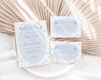 May include: Blue and white baby shower invitation cards with a hot air balloon theme. The cards include a baby shower invitation, a diaper raffle card, and a books for baby card. The text on the invitation card reads "Boy Oh Boy! Please join us for a Baby Shower in honor of Amelia Johnson. Saturday, March 17 at 2:00pm. The event will be held at [address]. RSVP by [date] to [phone number]."