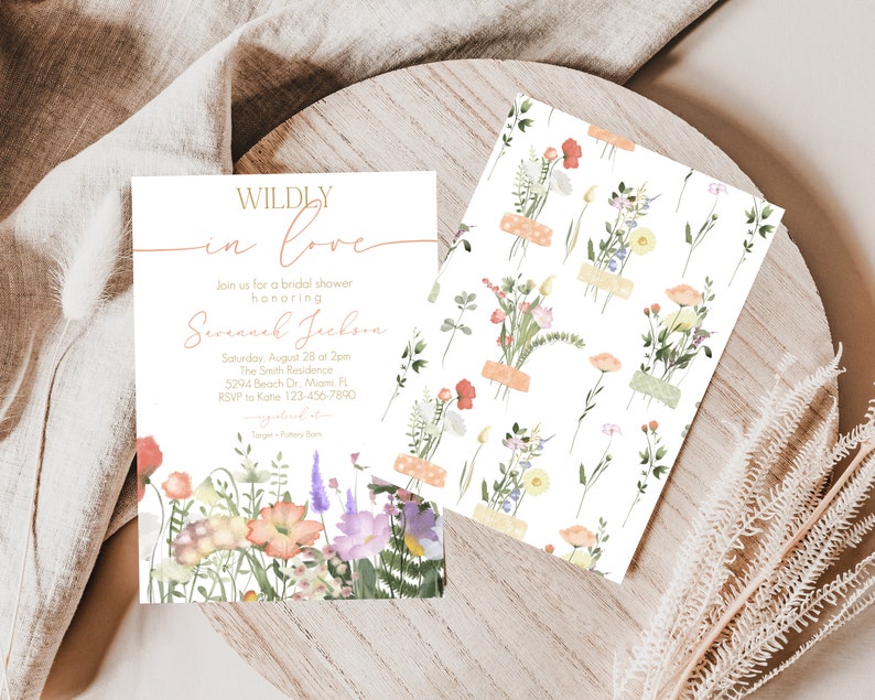May include: A bridal shower invitation with a floral design. The invitation reads "Wildly in Love" and includes the name "Savannah Jackson". The invitation is for a bridal shower on August 28th at 2pm at The Smith Residence, 5294 Beach Dr., Miami, FL. RSVP to Katie at 123-456-7890.