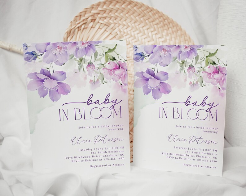 May include: Purple floral baby shower invitation with the text "baby in bloom" and the name "Olivia Peterson". The invitation includes the date, time, location, and RSVP information. It also states that the guest of honor is registered at Amazon.
